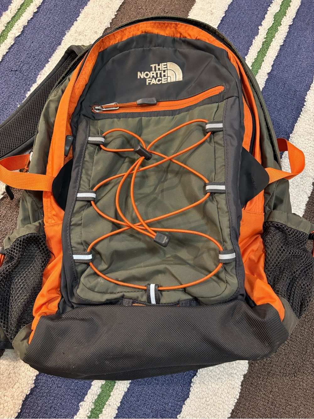 The North Face Olive Green & Orange Backpack with Bungee Front